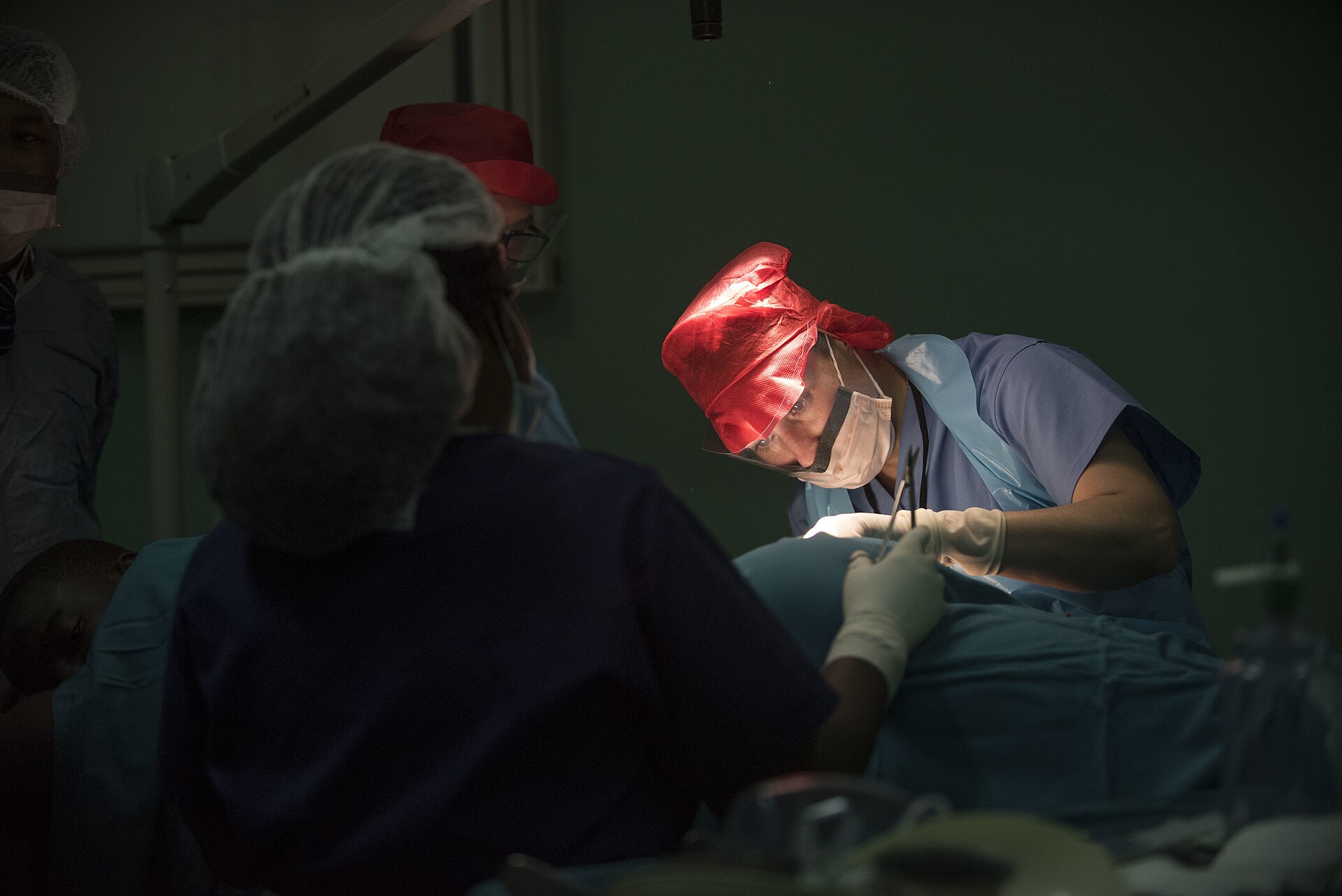 Ghanaian health workers treating a patient.